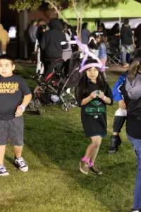 Boy-next-to-bounce-house-AMS0Night-Event-1